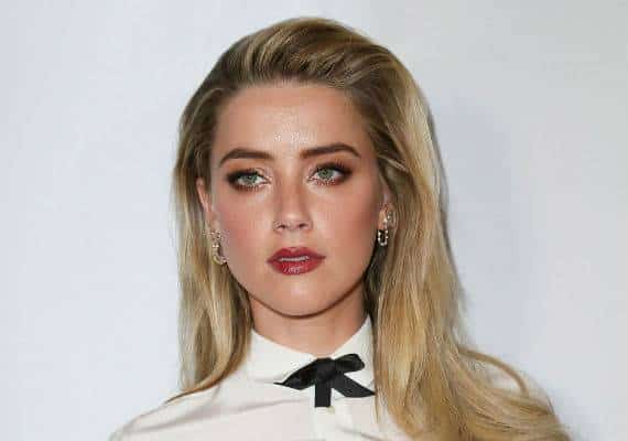 עמדה בהבטחתה: אמבר הרד תרמה את כספי הגירושים שלה לבית חולים לילדים