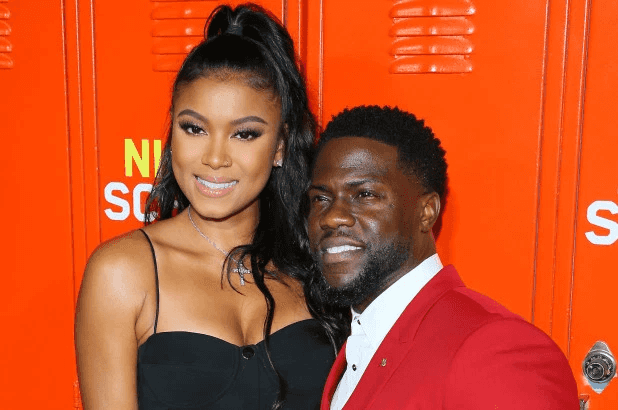 המלאך השומר: אשתו של קווין הארט משגיחה שלא יעשה שטויות בסיבוב ההופעות